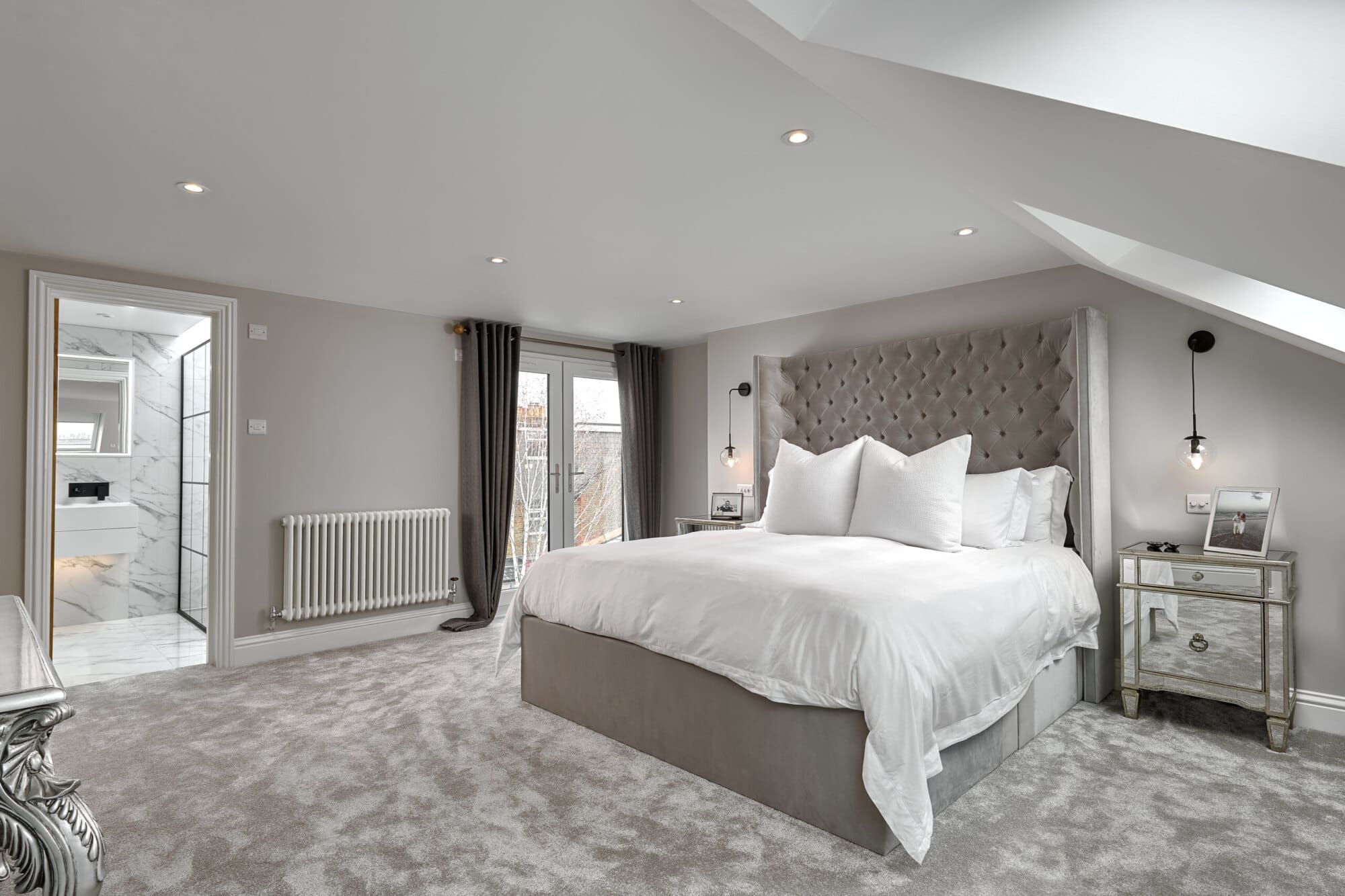 luxury white bedroom fitted as shell loft conversion